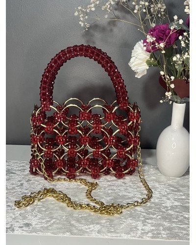 Sac à main en cristal et anneaux dorés